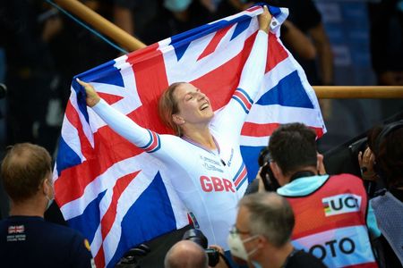 Great Britain's Neah Evans celebrates her victory after winning the Womens Points Race 25km final during the UCI Track Cycling World Championships at the Velodrome of SaintQuentinenYvelines southwest of Paris on October 16 2022 Photo by AnneChristine POUJOULAT AFP Photo by ANNECHRISTINE POUJOULATAFP via Getty Images