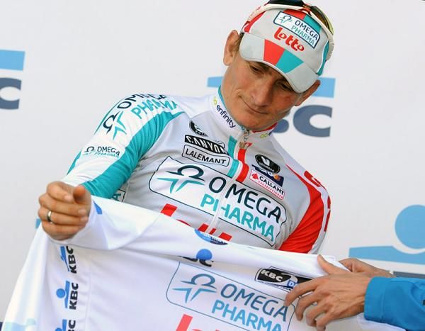 Andr&eacute; Greipel (Omega Pharma-Lotto) dons the leader's jersey.