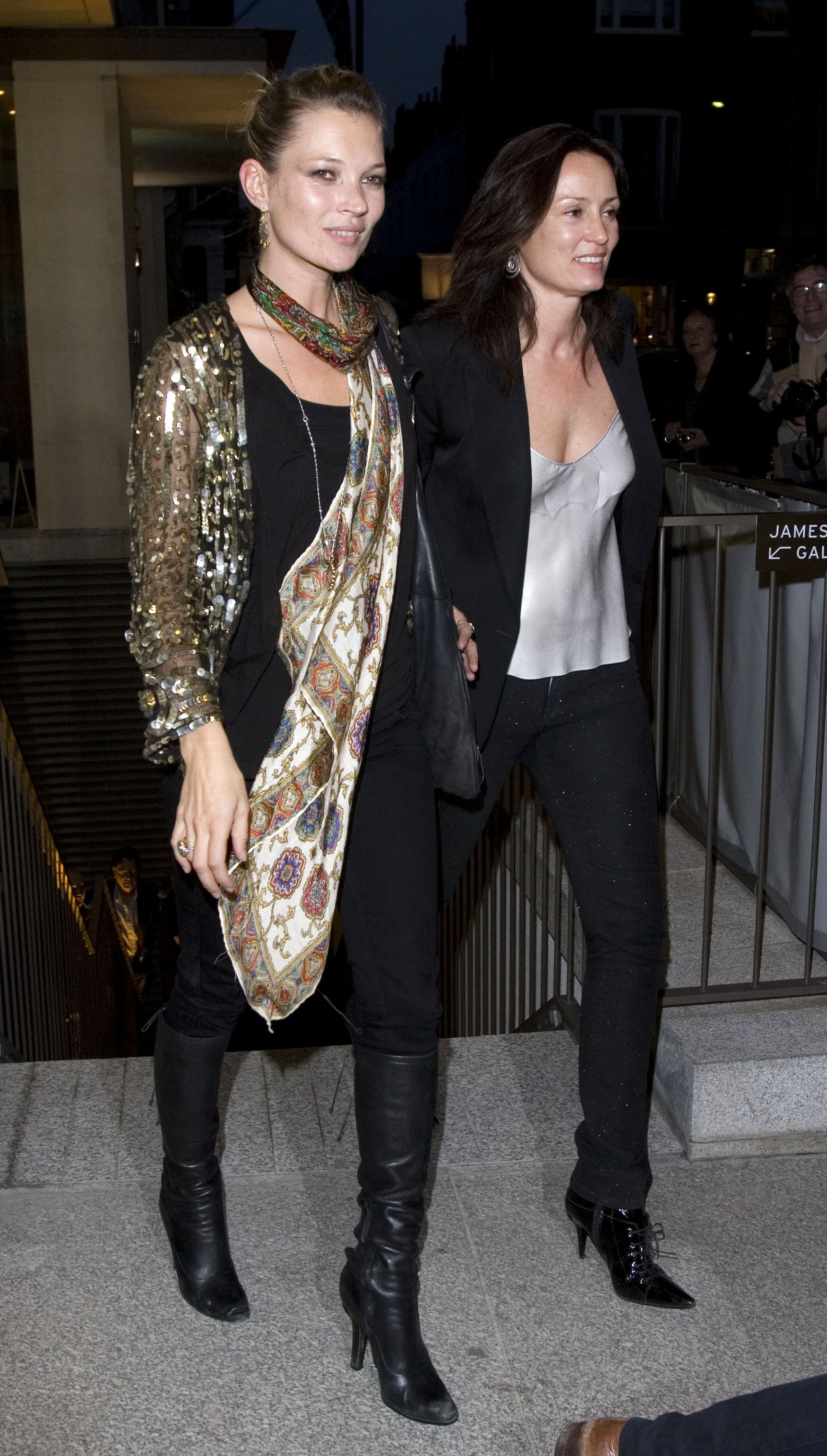 Kate Moss wearing a sequin top and silk scarf
