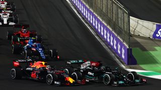 Max Verstappen and Lewis Hamilton vying for track position during the restart of the 2021 F1 Saudi Arabian GP