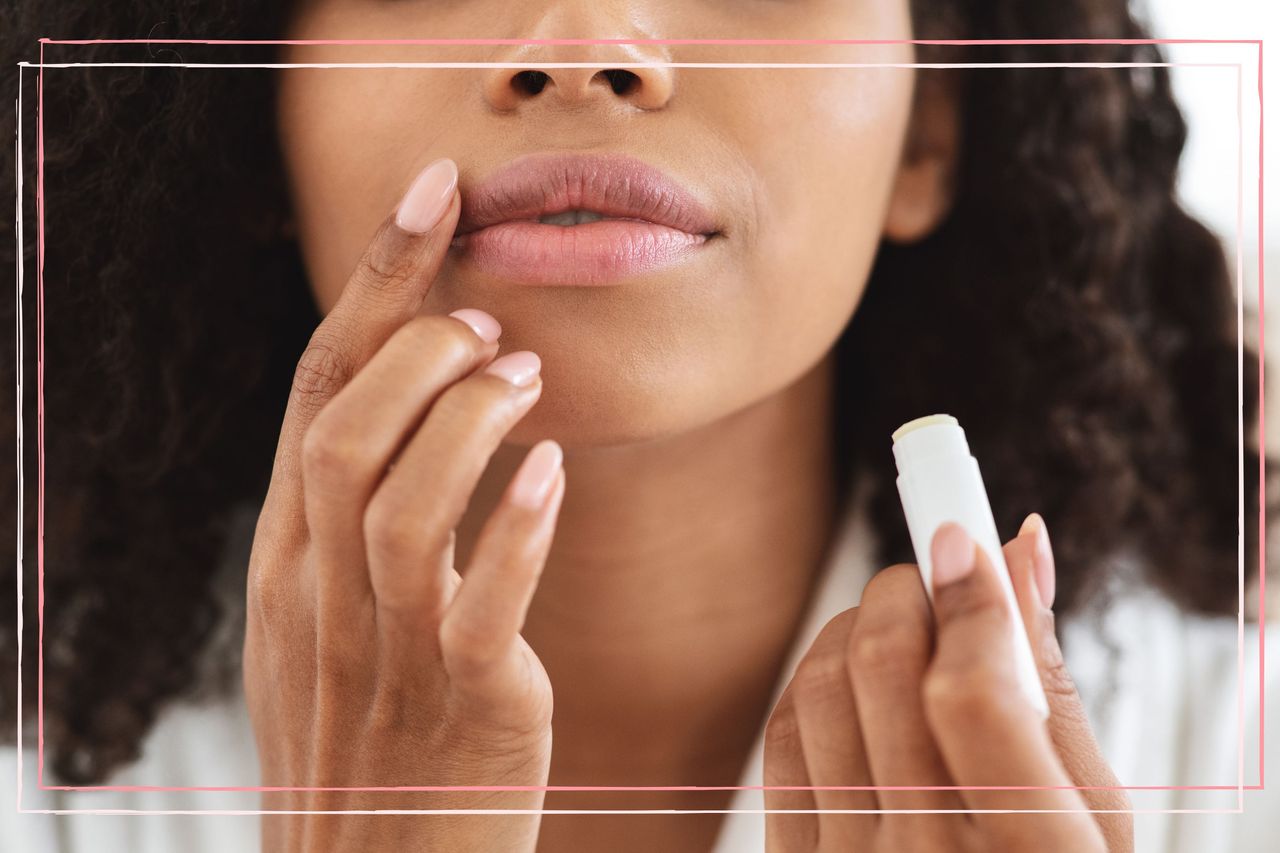 close in shot of woman applying lip balm to illustrate dry lips in pregnancy