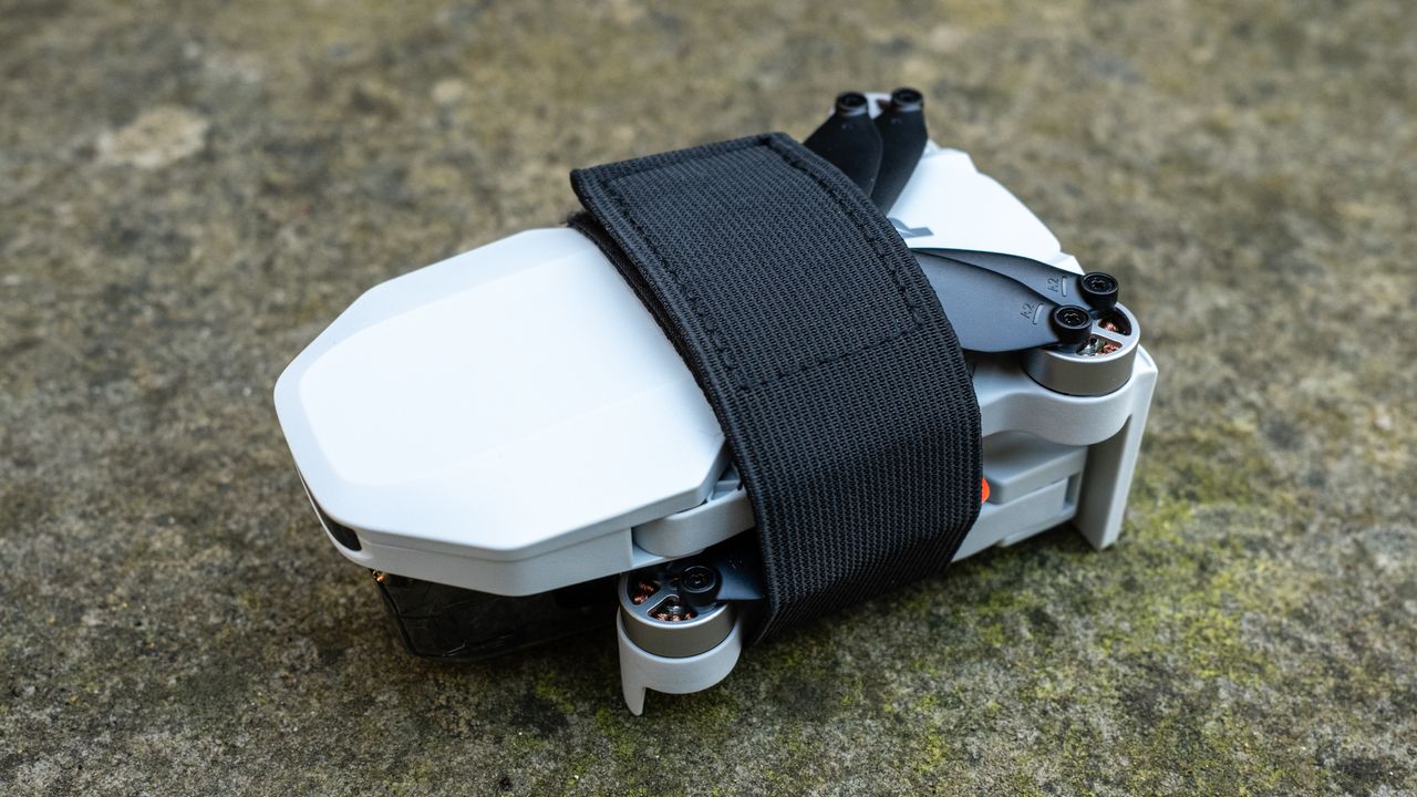Potensic Atom 2 folded with the propeller strap attached