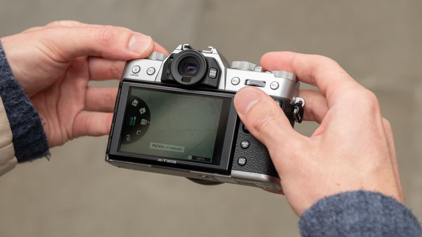 Fujifilm X-T30 III camera held in a pair of hands