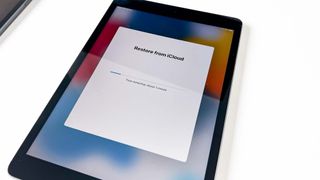 An iPad restoring from iCloud
