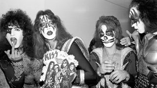 Paul Stanley, Ace Frehley, Peter Criss and Gene Simmons of the rock and roll band Kiss receive presents from their fans backstage in 1976 in Los Angeles, California. 