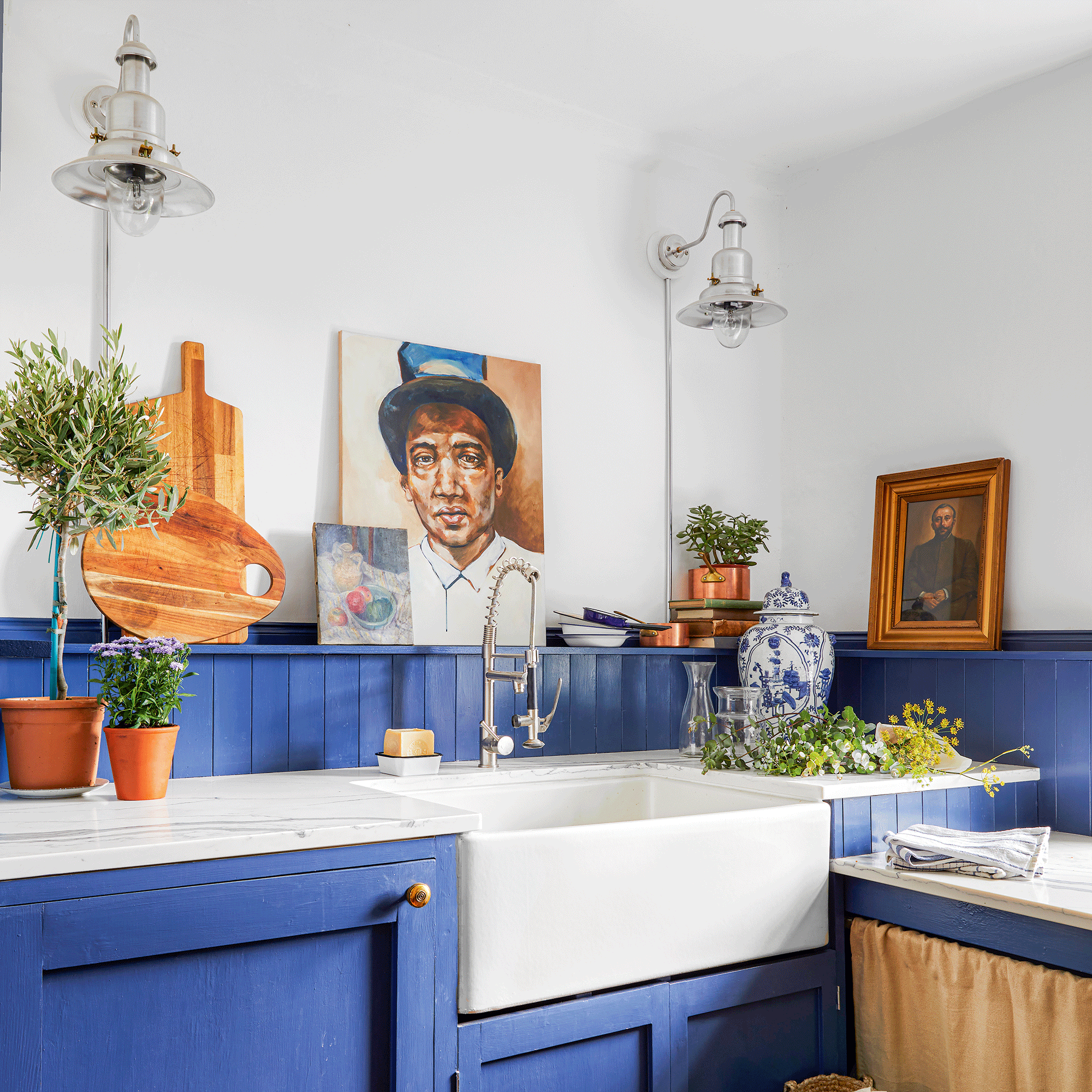 Cobalt blue cupboards and splashback with sink