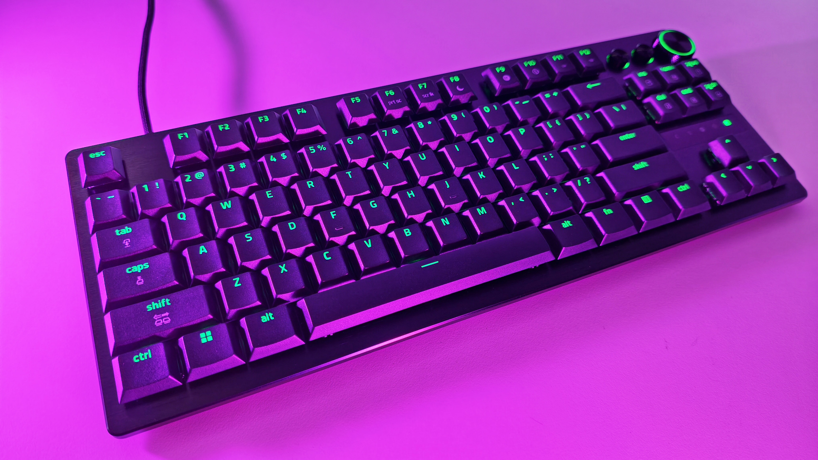 Side profile view highlighting the ultra-slim design and low-profile optical switches of the Razer Huntsman V3 Pro TKL keyboard.