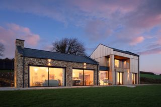 exterior of self build with stone and timber cladding