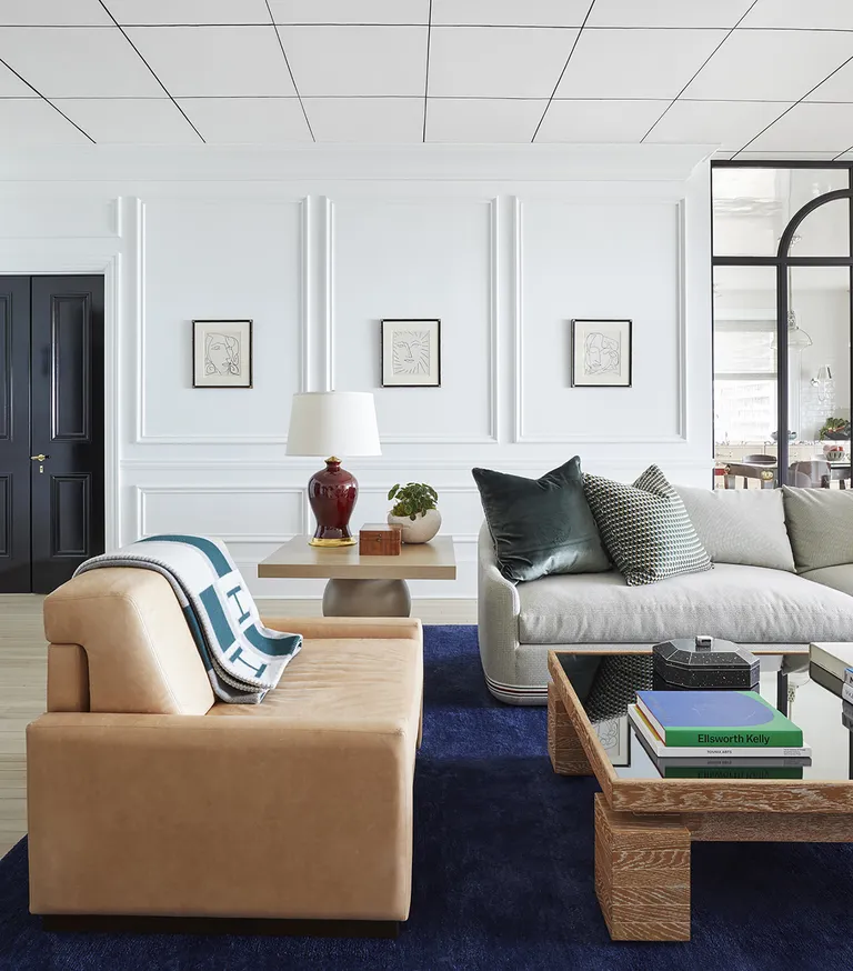 a living room with a handpainted wallpaper ceiling