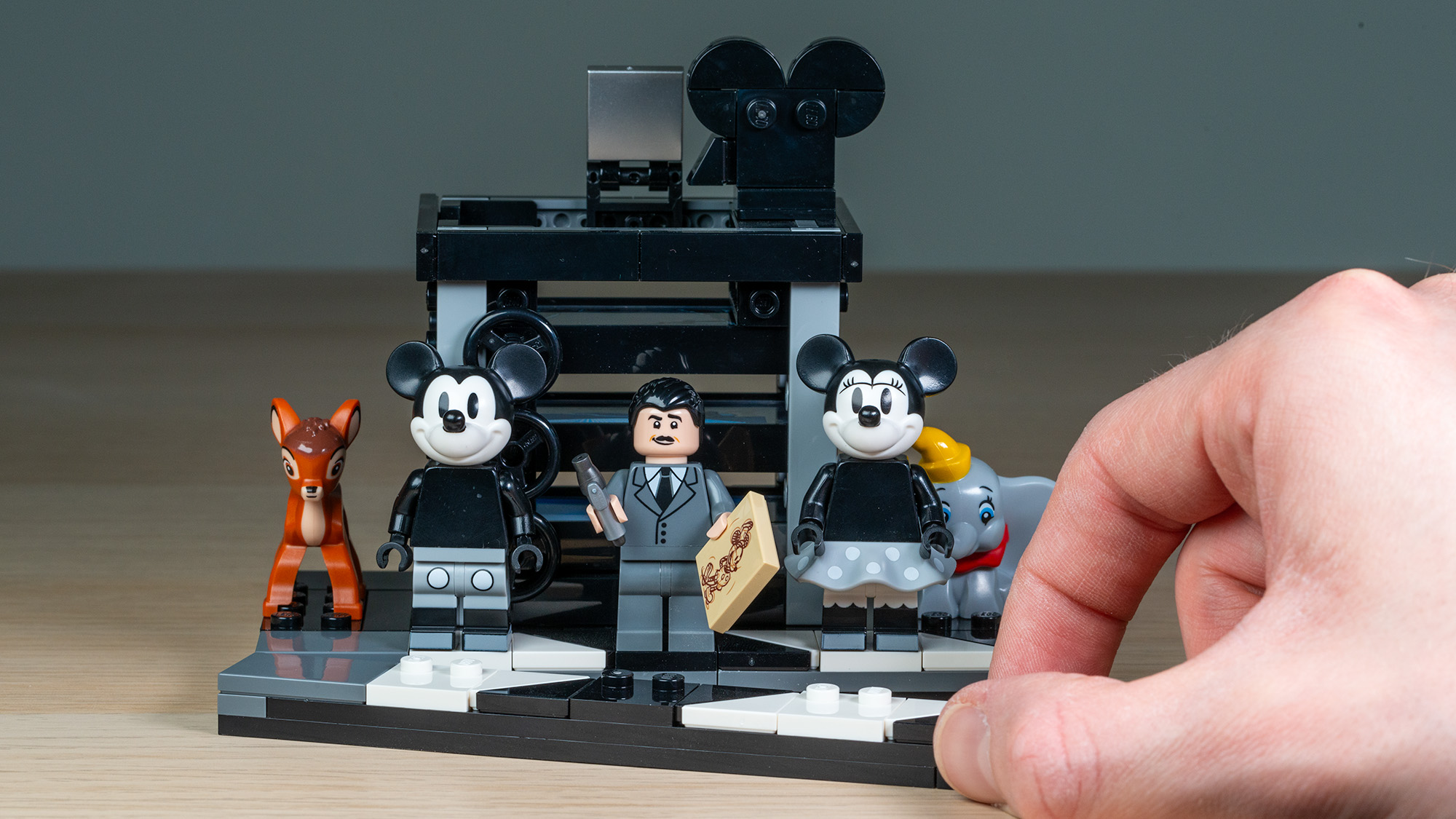 Lego Walt Disney Tribute Camera (43230) multi-plane camera side build and Minifigures with hand in frame
