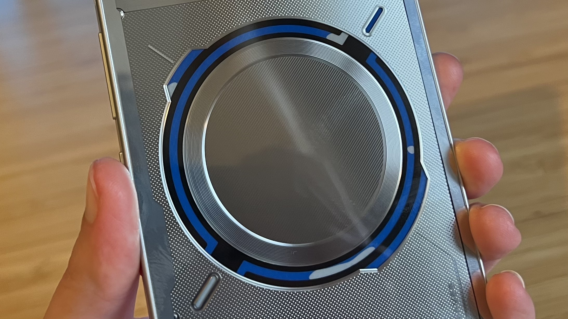 Close up on circular window into liquid cooling system on RedMagic 11 Pro