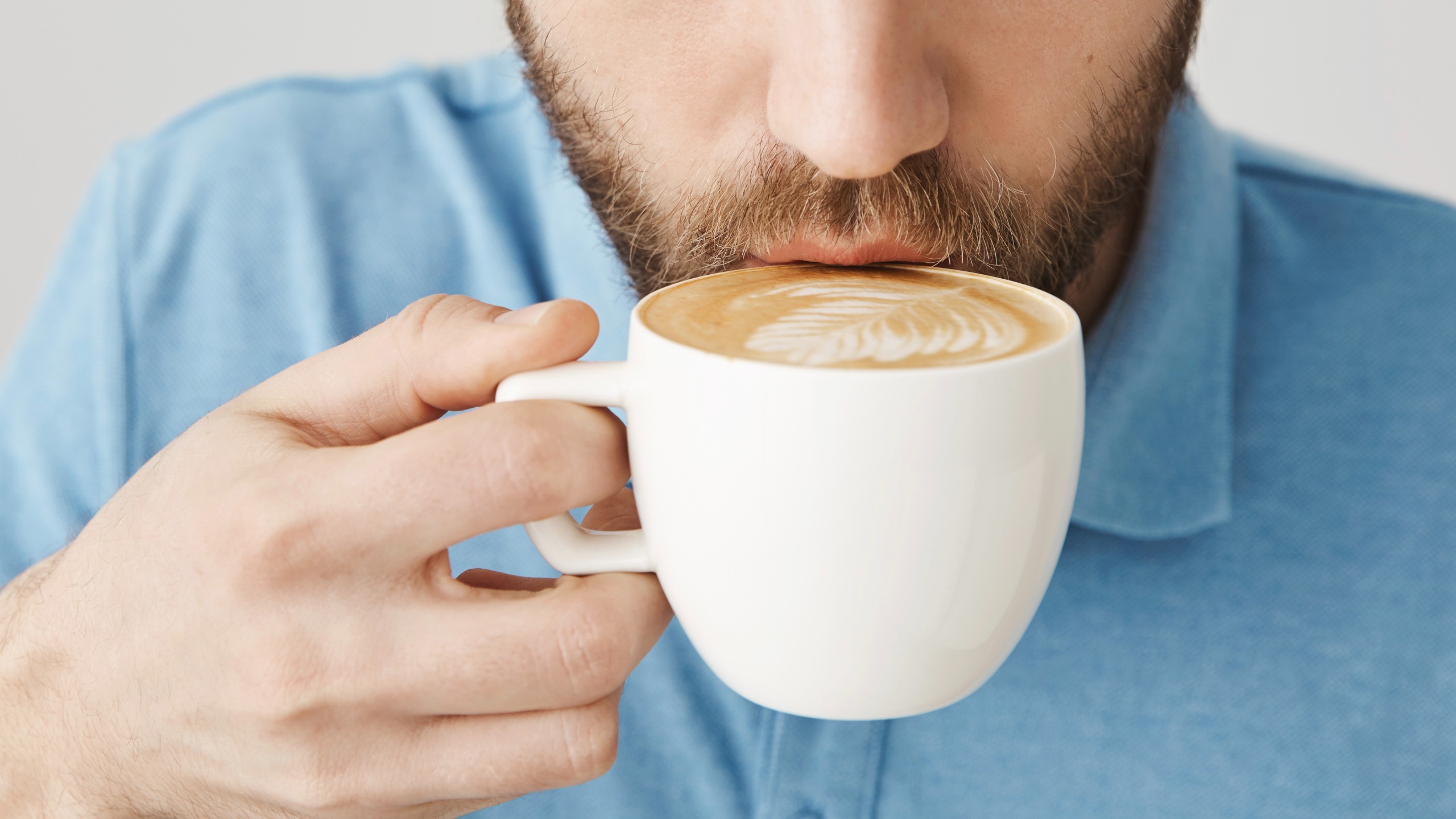 man drinking coffee