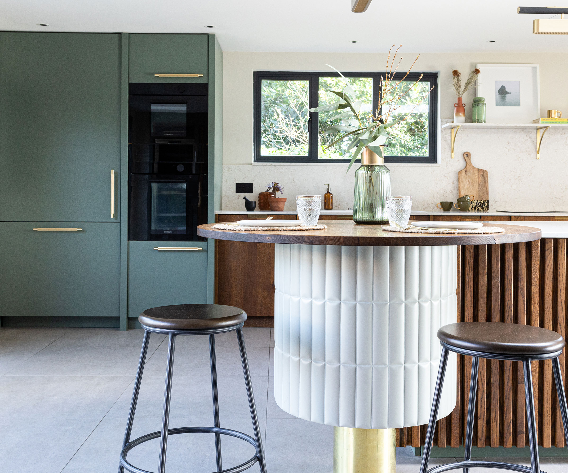 modern green and wooden kitchen with fluted kitchen island