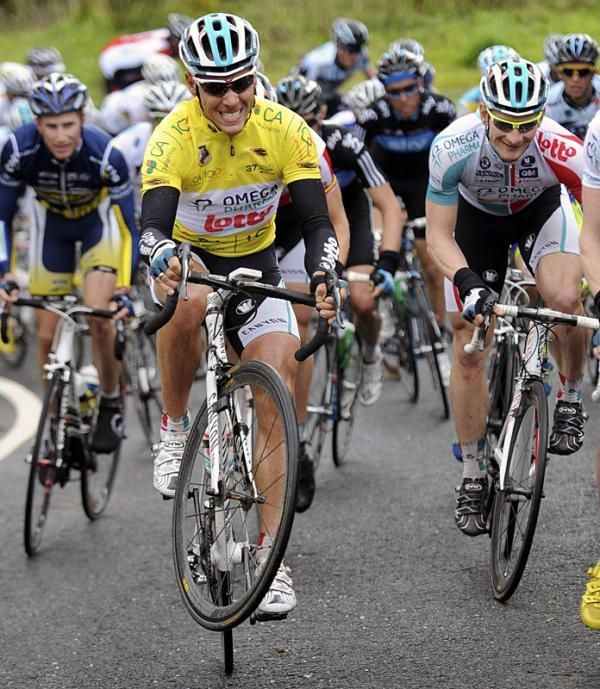 Race leader Philippe Gilbert has so much power in his legs he has trouble keeping the front wheel on the ground.