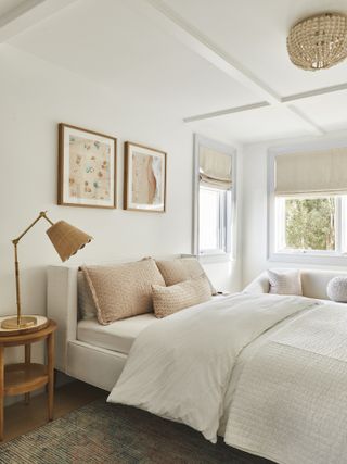A bedroom with a monochromatic color palette of sandy pink tones