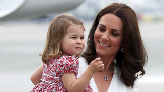 Catherine, Duchess of Cambridge carries Princess Charlotte of Cambridge as they arrive with Prince William, Duke of Cambridge and Prince George of Cambridge on day 1 of their official visit to Poland on July 17, 2017 in Warsaw, Poland