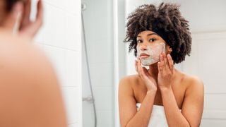 woman applying skin care products