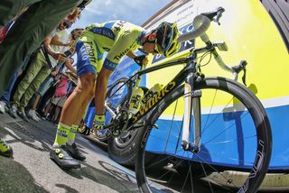 Alberto Contador checks his bike before the stage