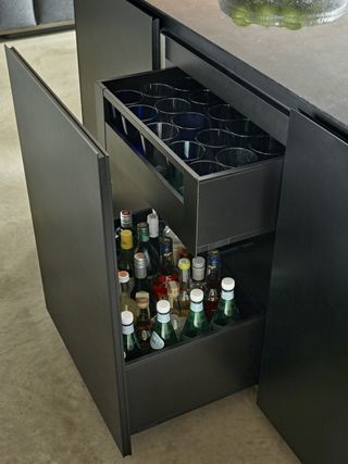 bottles and glassware in a pull-out unit