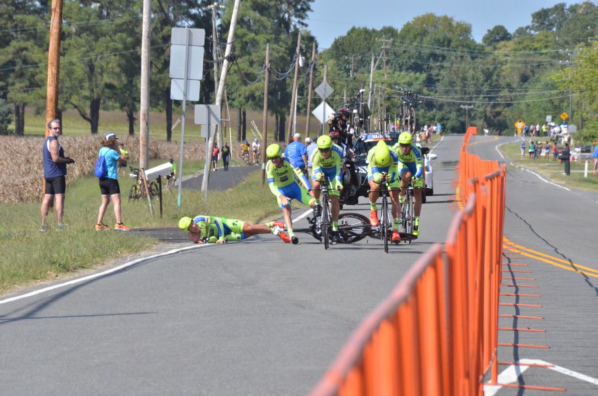 Michael Valgren hits the ground as Michael Rogers tries to stay upright