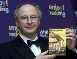 Philip Pullman at the Whitbread Prize in 2002 with his book, The Amber Spyglass