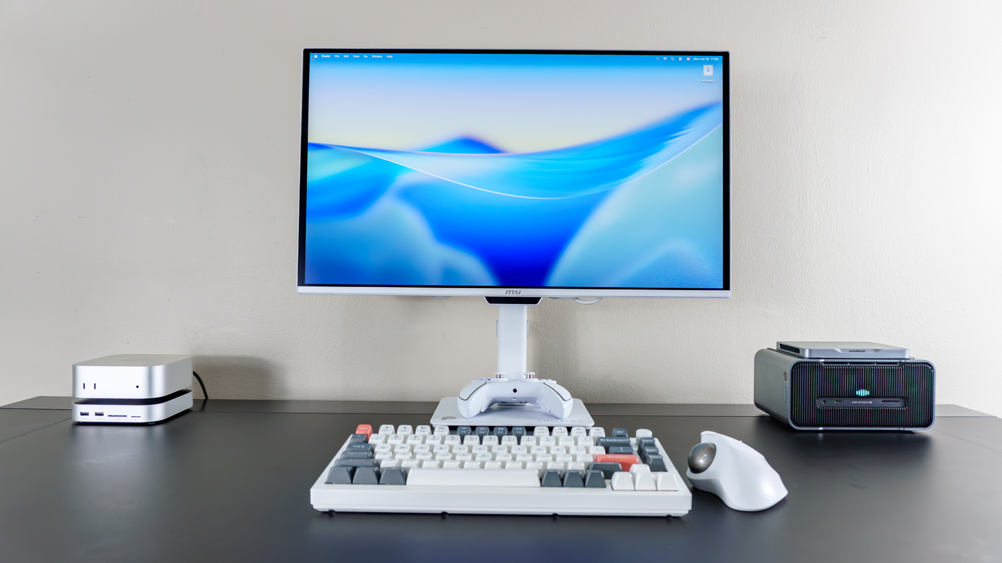 The Ugreen Mac Mini M4 Dock &amp;amp; Stand underneath a Mac mini M4 mini PC in a desk setup