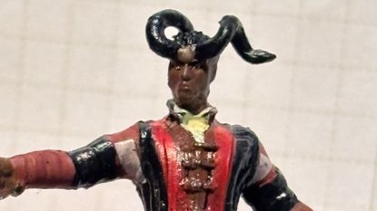 Baldur's Gate 3 Wyll miniature against a grid background