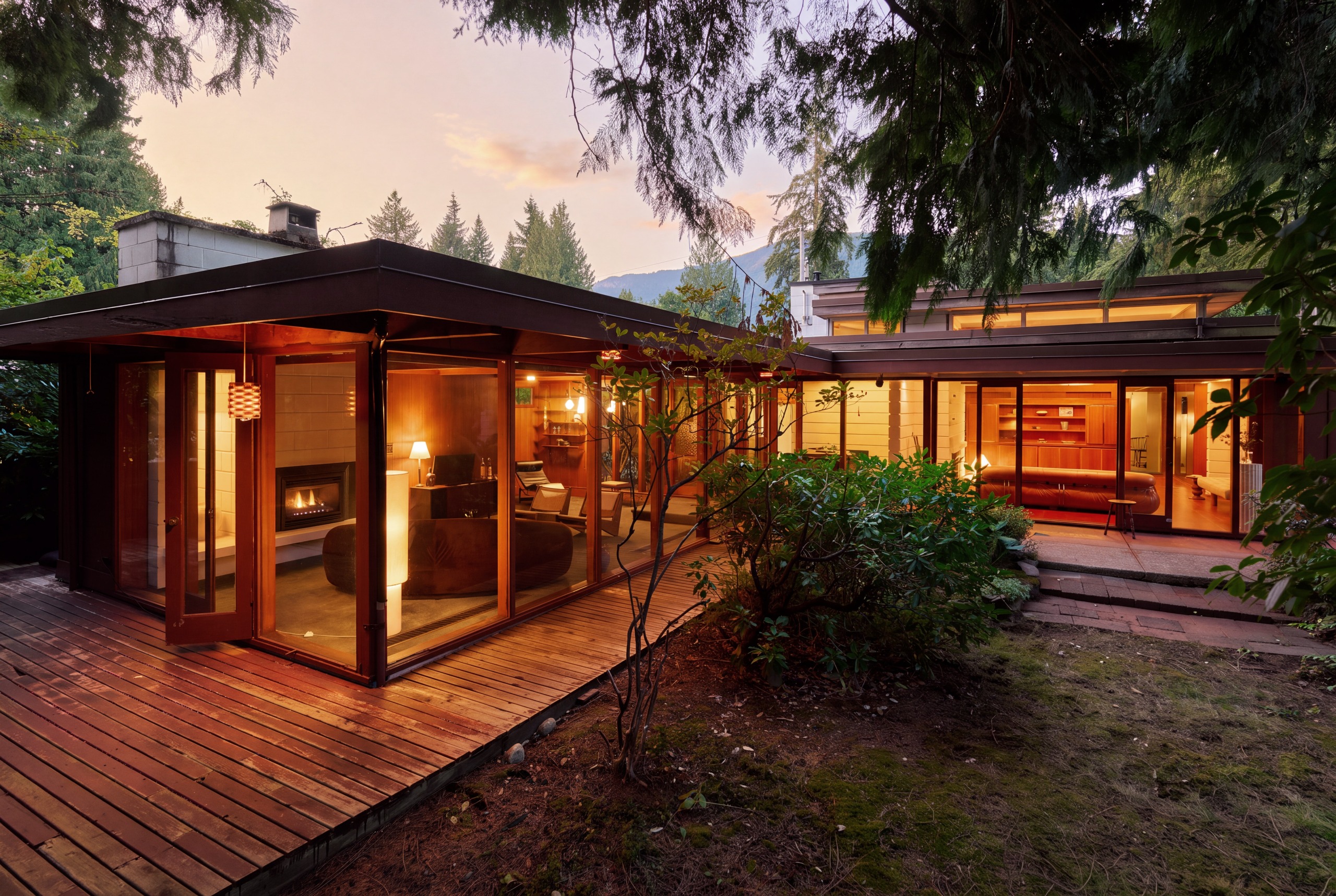 The house is integrated into a mature private garden