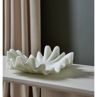 white smooth stoneware bowl with ruffled wave-like rim