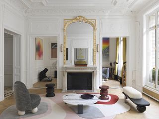 A french living room with gilded mirror