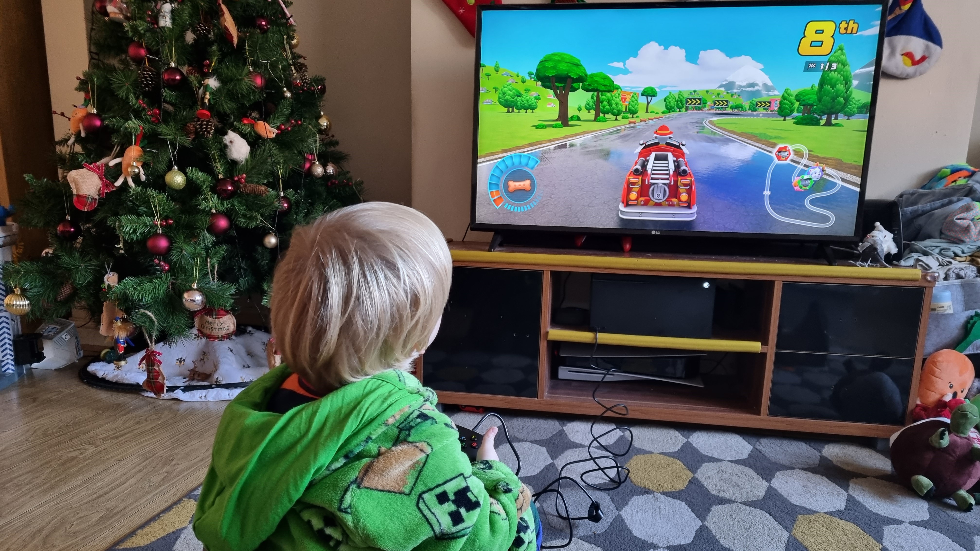 Child using PowerA Nano Controller to play Paw Patrol Racing on GamePass