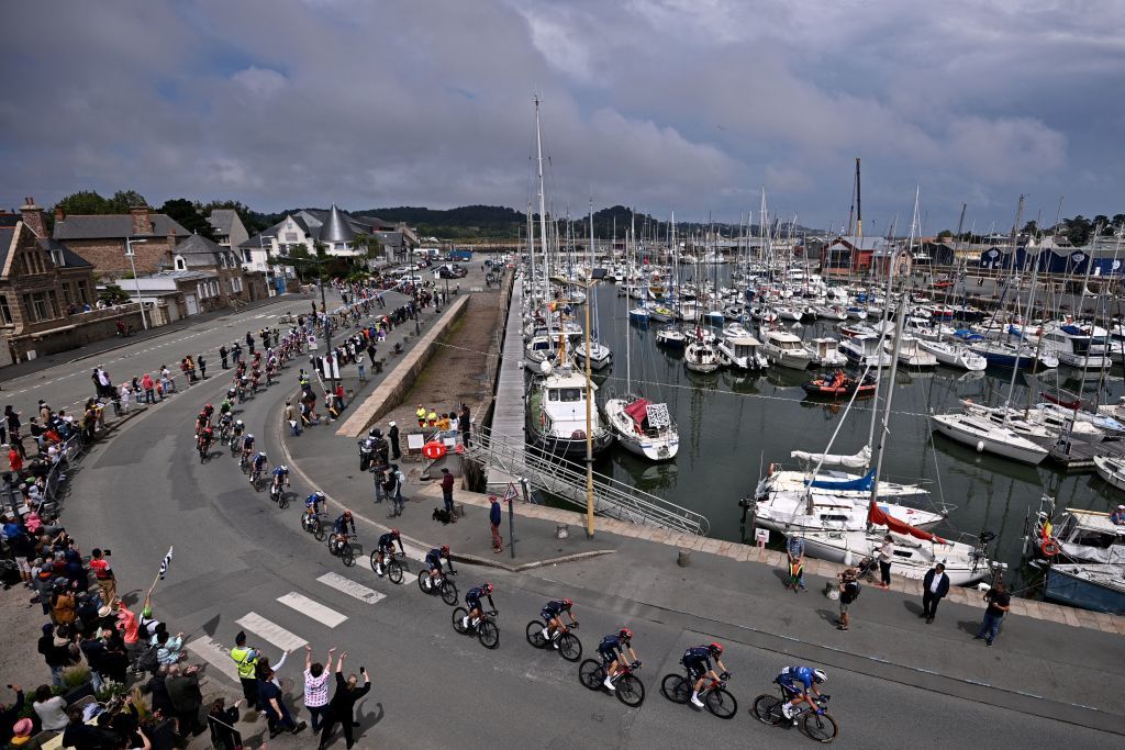 The pack rides during the 2nd stage of the 108th edition of the Tour de France cycling race 183 km between PerrosGuirrec and Mur de Bretagne Guerledan on June 27 2021 Photo by AnneChristine POUJOULAT AFP Photo by ANNECHRISTINE POUJOULATAFP via Getty Images