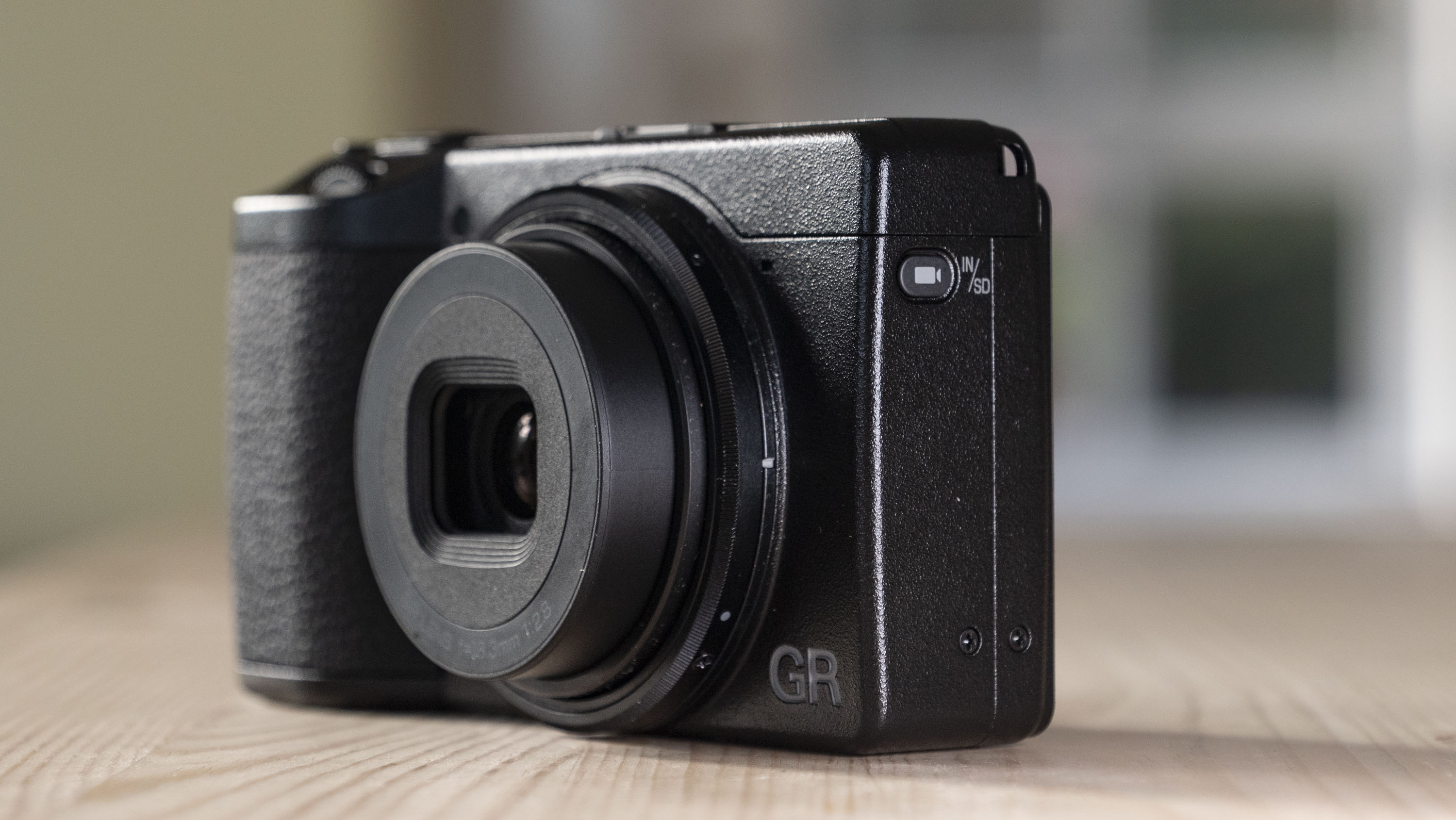 Close up of the Ricoh GR IV compact camera's video button 