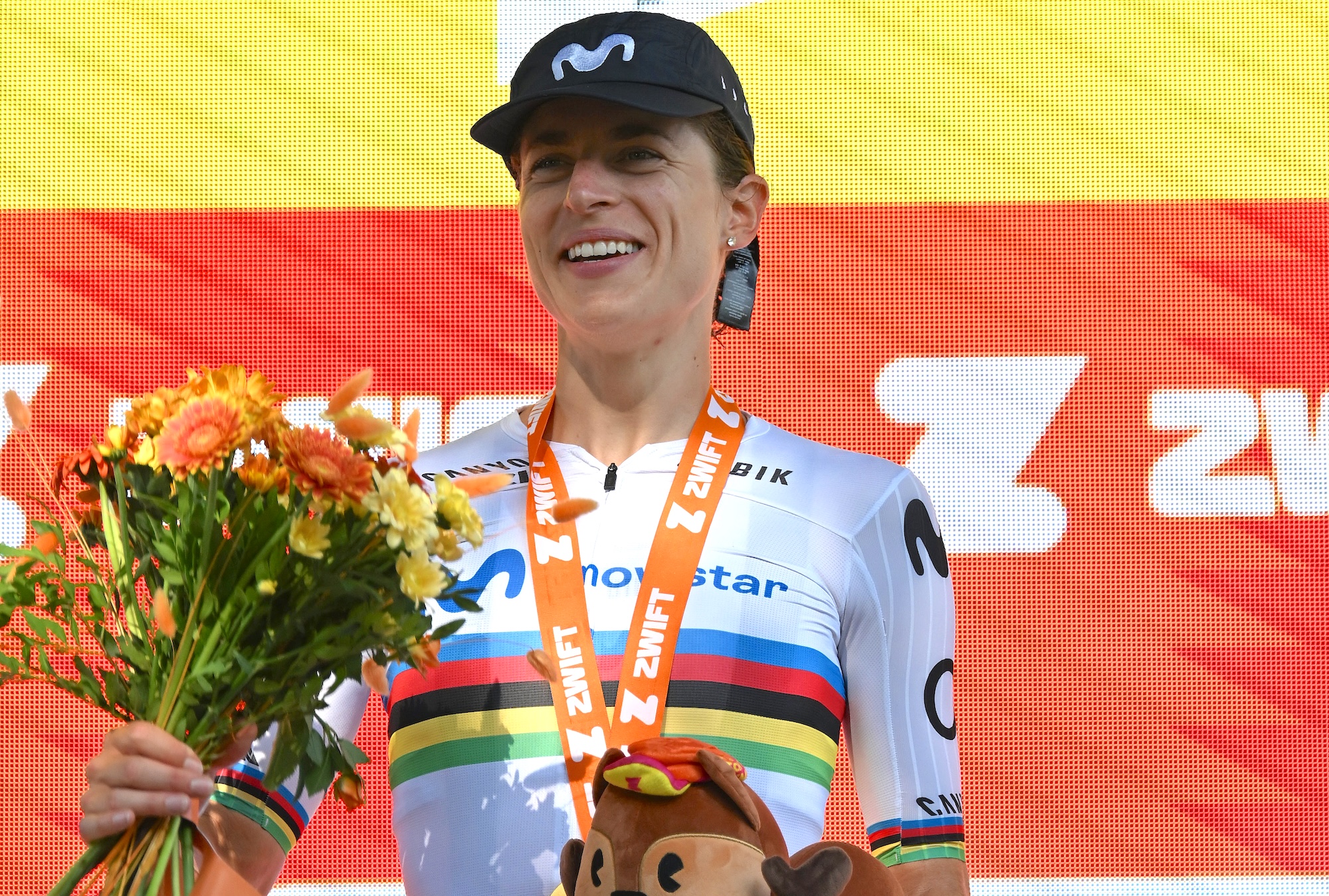 Marlen Reusser (Movistar) of Switzerland celebrates at podium as stage 4 winner