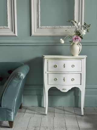 Chalk paint makes a similar effect to milk paint on this small dresser
