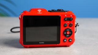 A red Kodak PIXPRO WPZ2 compact camera