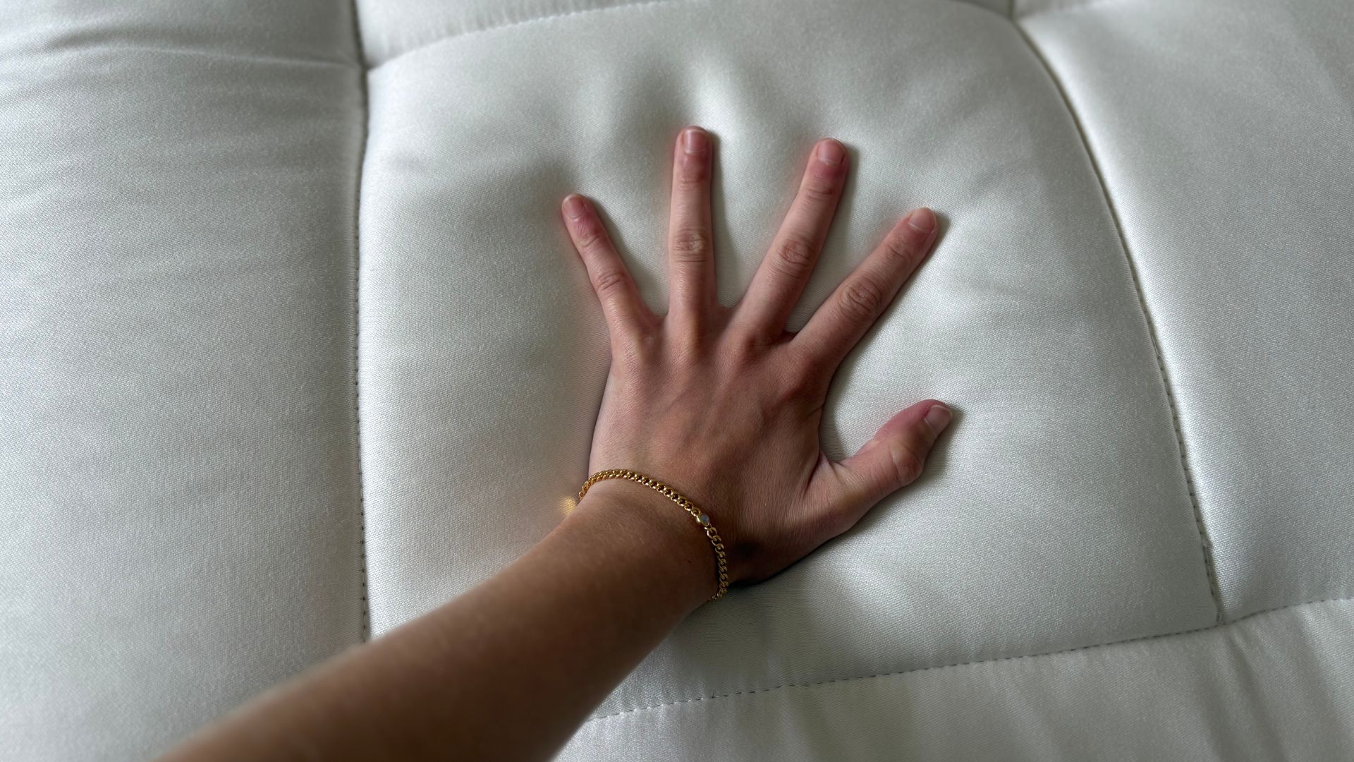 Simba Earth Apex Mattress with my hand on it