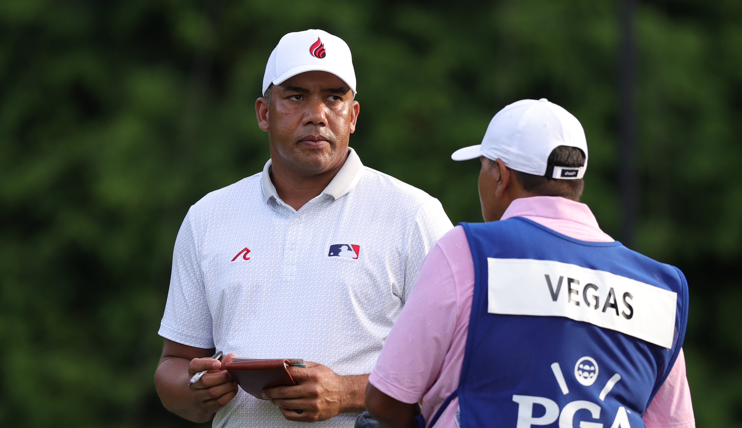 Jhonattan Vegas talks to his caddie
