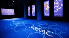 RSAC 2026 conference logos and branding pictured on screens and projected onto carpet at the Moscone Center in San Francisco, USA.