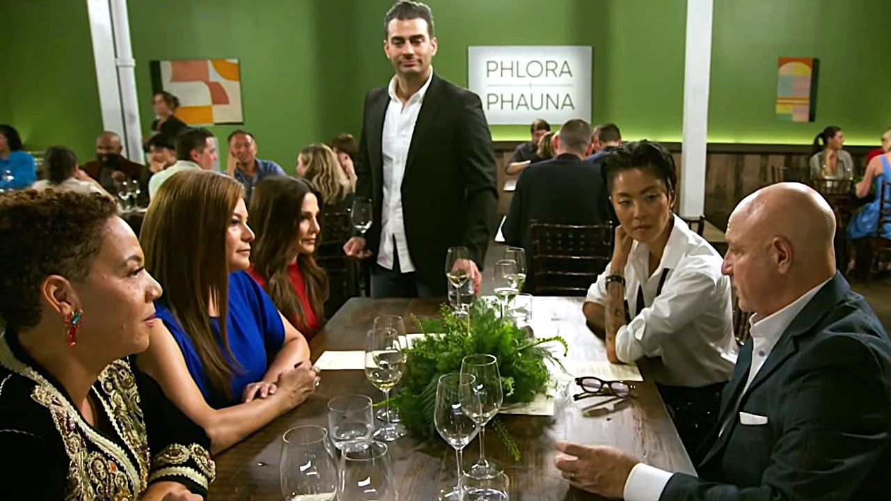 Massimo Piedimonte hovers as Gail, Kristen, Tom and the guest judges deliverate on Top Chef: Destination Canada, Season 22.
