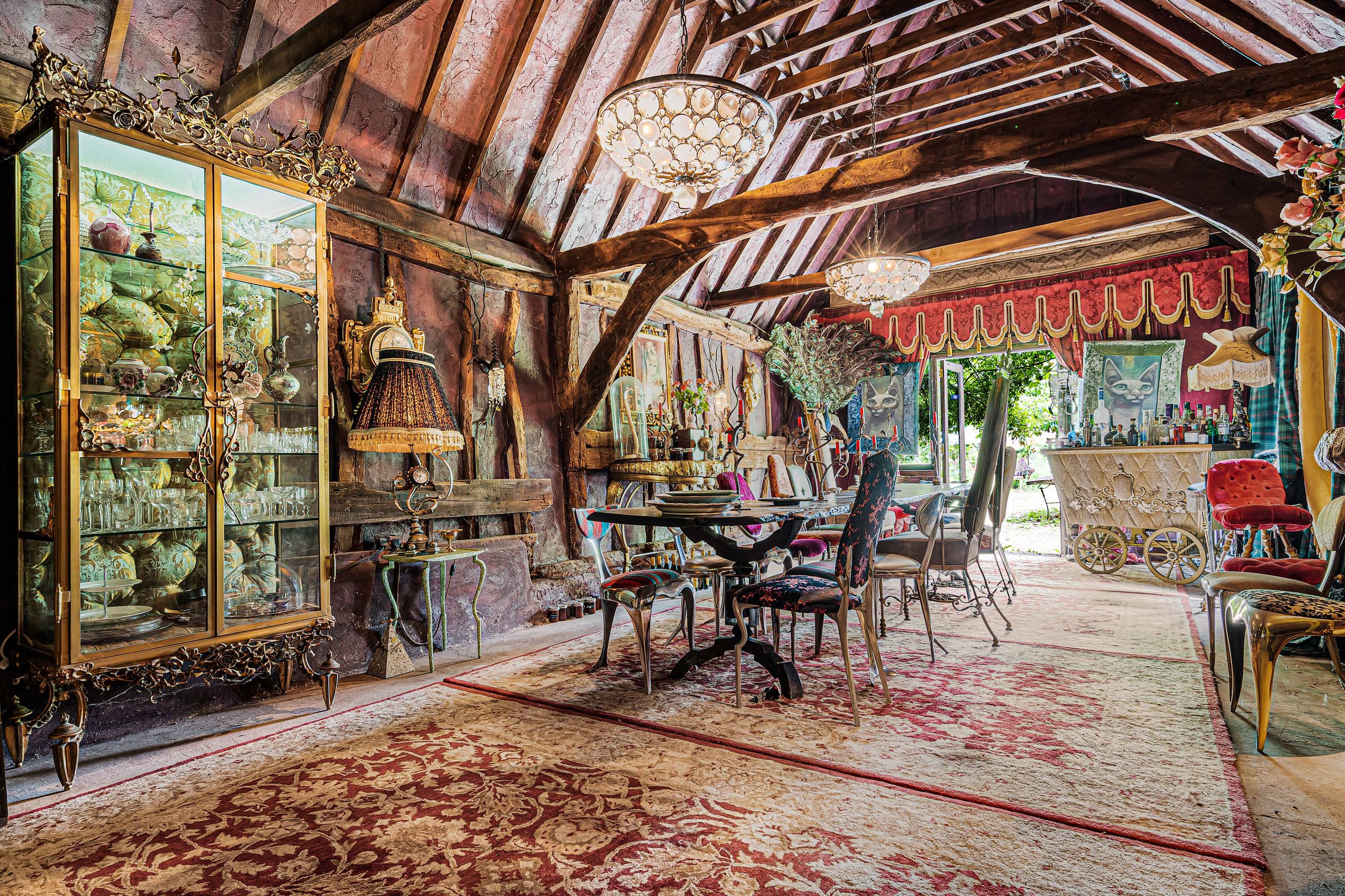 A 400-year-old cottage for sale with vivid and bohemian interiors that are, quite literally, works of art