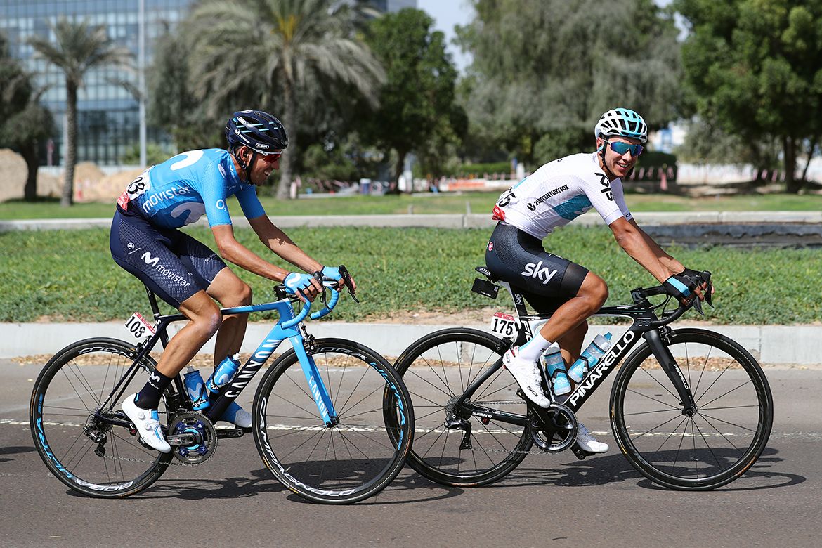 Sebastian Henao and Victor de la Parte have a laugh in the peloton