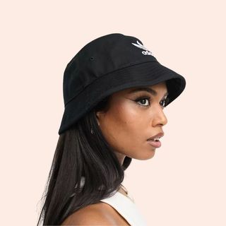 Flat lay image of woman wearing bucket hat