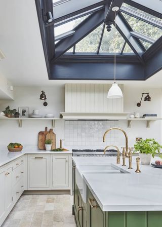 green and white kitchen with black roof lantern