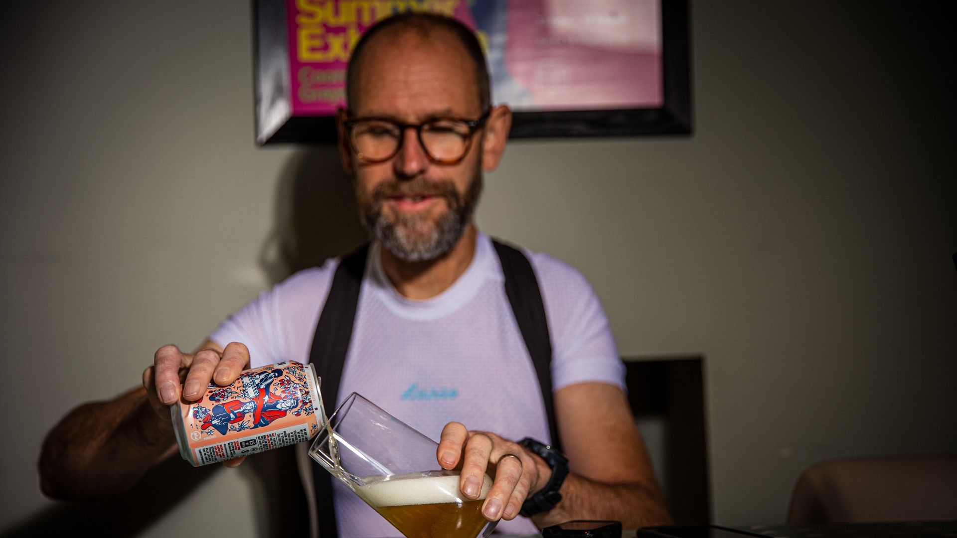 a cyclist relaxing and pouring as beer