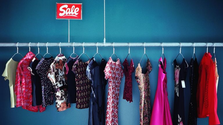 Women's clothes on a rail on sale
