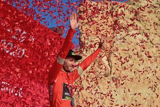 Adam Yates of MitcheltonScott team celebrates in the red jersey of race leader during the 5th stage of the UAE Cycling Tour from alAin to Jebel Hafeet on February 27 2020 Photo by GIUSEPPE CACACE AFP Photo by GIUSEPPE CACACEAFP via Getty Images