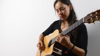 Woman playing high-end classical guitar