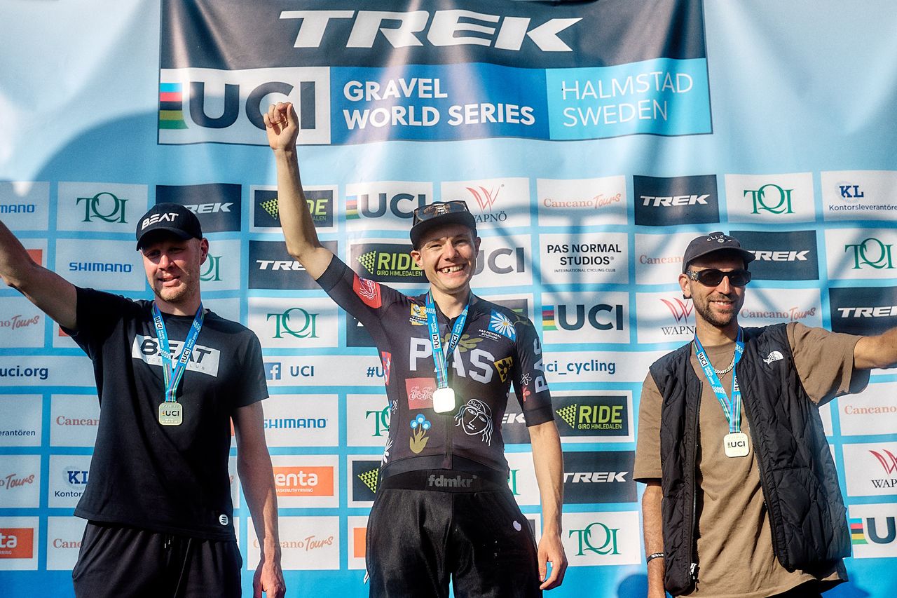 Elite men's podium of Tobias Perry in first, Tijmen Eising second and Jasper Ockeloen third at Gravel Grit 'n Grind, UCI Gravel World Series round in Halmstad, Sweden 2024