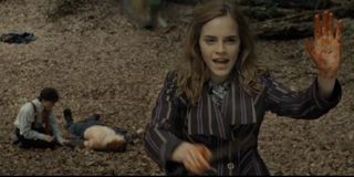 Hemione Granger protects a campsite for Harry Potter and Ron Weasley